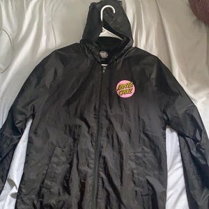 Black Santa Cruz Skateboarding zip up jacket.